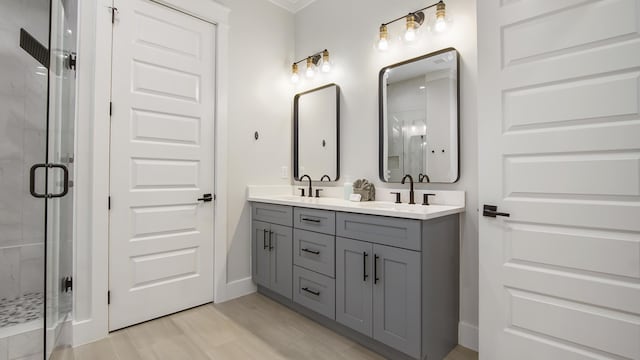 51 W Okeechobee, Santa Rosa Beach, FL 32459 - bathroom featuring double vanity, a shower stall, and baseboards