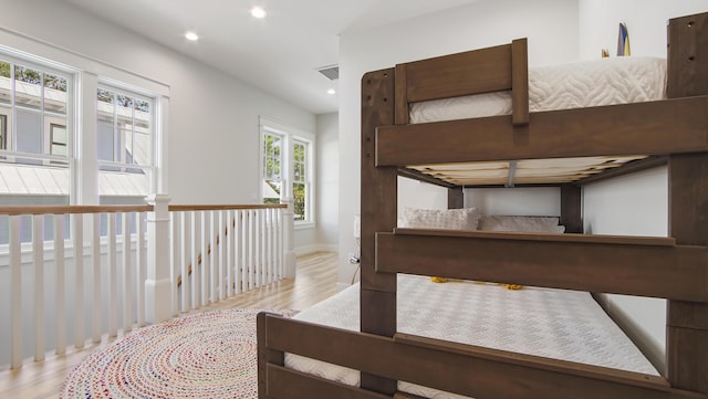 51 W Okeechobee, Santa Rosa Beach, FL 32459 - hallway featuring wood finished floors, recessed lighting, baseboards, and an upstairs landing