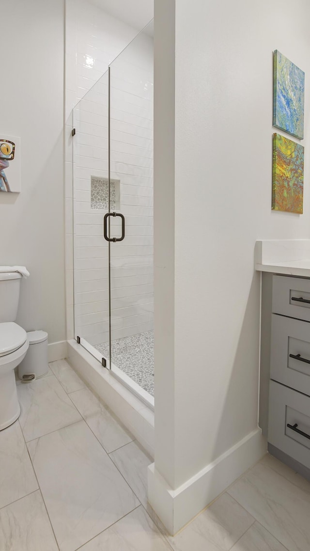 51 W Okeechobee, Santa Rosa Beach, FL 32459 - full bathroom with marble finish floors, toilet, baseboards, and a stall shower