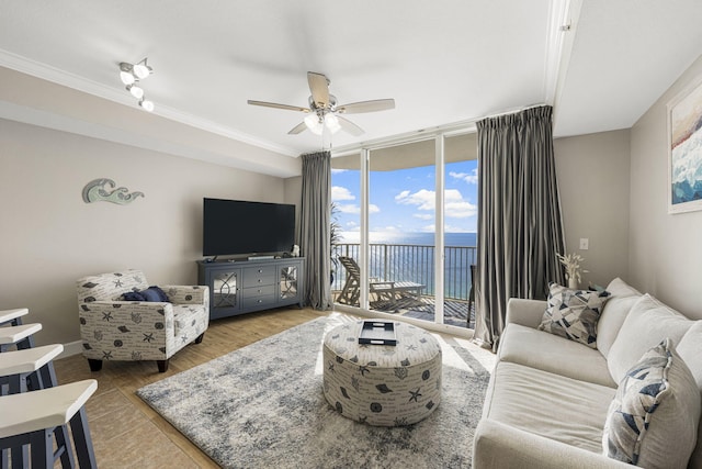 16819 Front Beach Rd Unit 2116, Panama City Beach, FL 32413 - living area featuring ceiling fan, ornamental molding, a wall of windows, and wood finished floors
