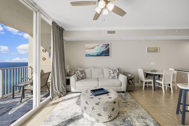 16819 Front Beach Rd Unit 2116, Panama City Beach, FL 32413 - living room featuring a ceiling fan, crown molding, plenty of natural light, and a water view
