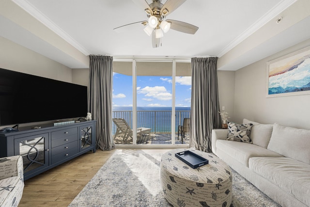 16819 Front Beach Rd Unit 2116, Panama City Beach, FL 32413 - living area featuring a wall of windows, a water view, light wood-type flooring, ornamental molding, and a ceiling fan