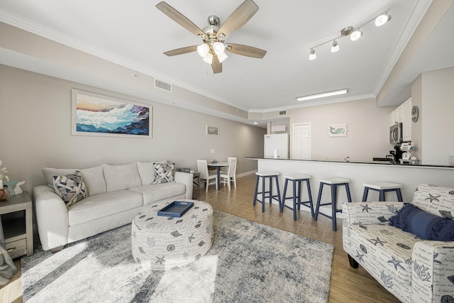16819 Front Beach Rd Unit 2116, Panama City Beach, FL 32413 - living area with ornamental molding, ceiling fan, and baseboards