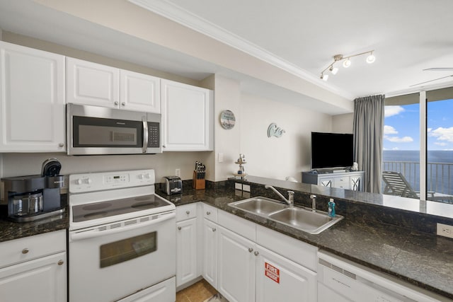 16819 Front Beach Rd Unit 2116, Panama City Beach, FL 32413 - kitchen featuring white appliances, a sink, white cabinetry, ornamental molding, and a wall of windows