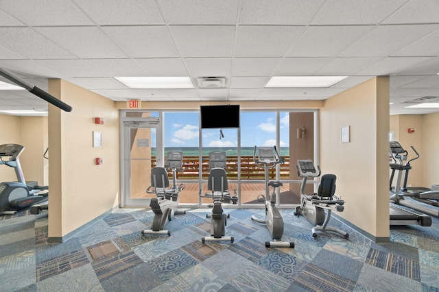 16819 Front Beach Rd Unit 2116, Panama City Beach, FL 32413 - workout area with carpet floors, a paneled ceiling, and baseboards