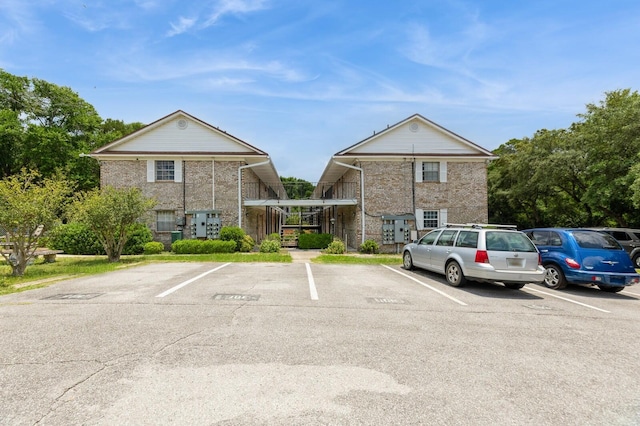 104 Country Club Dr Unit 104, Niceville, FL 32578 - view of property featuring uncovered parking