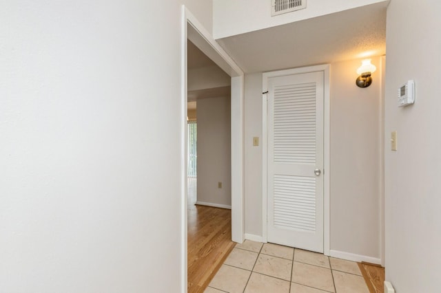 104 Country Club Dr Unit 104, Niceville, FL 32578 - corridor with baseboards and light tile patterned floors