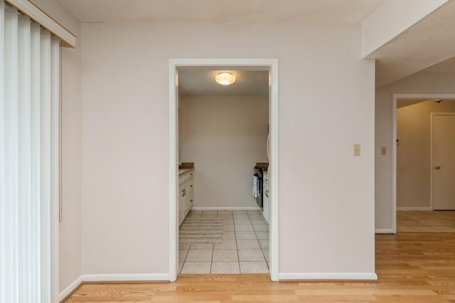 104 Country Club Dr Unit 104, Niceville, FL 32578 - hall with light tile patterned floors and baseboards