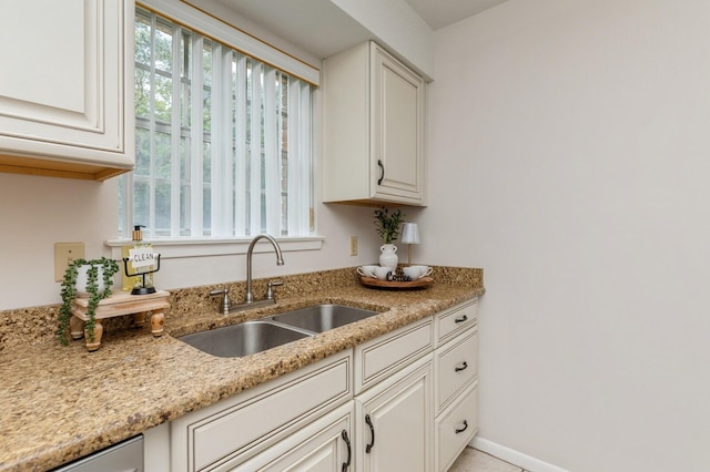 104 Country Club Dr Unit 104, Niceville, FL 32578 - kitchen featuring a sink, light stone counters, and white cabinets
