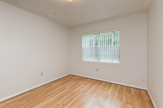 104 Country Club Dr Unit 104, Niceville, FL 32578 - spare room with wood finished floors and baseboards