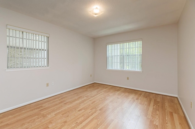 104 Country Club Dr Unit 104, Niceville, FL 32578 - unfurnished room featuring wood finished floors and baseboards