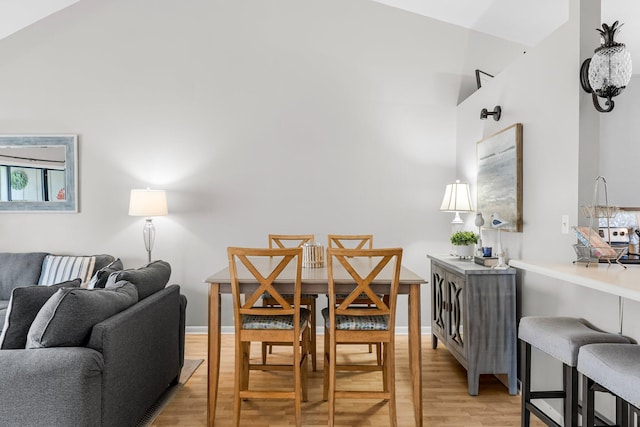 3755 Scenic Highway 98 Unit 1203, Destin, FL 32541 - dining area with light wood-type flooring and a high ceiling