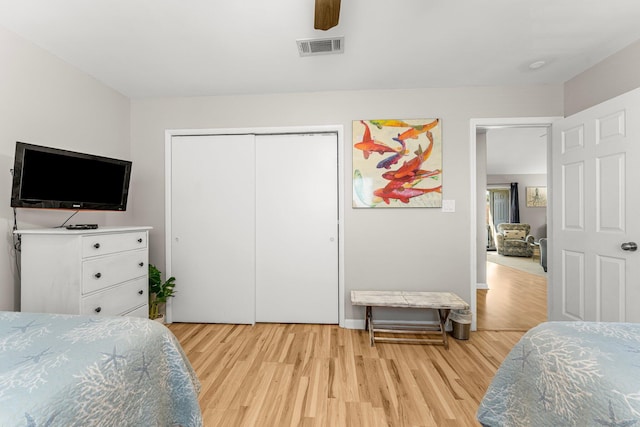 3755 Scenic Highway 98 Unit 1203, Destin, FL 32541 - bedroom with light wood finished floors, a closet, and ceiling fan