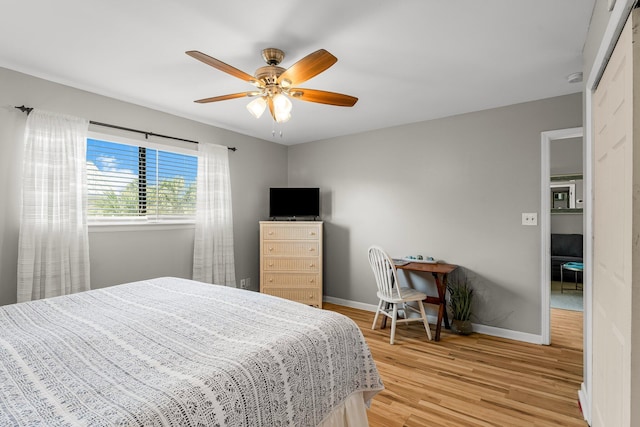 3755 Scenic Highway 98 Unit 1203, Destin, FL 32541 - bedroom featuring light wood finished floors, baseboards, and ceiling fan