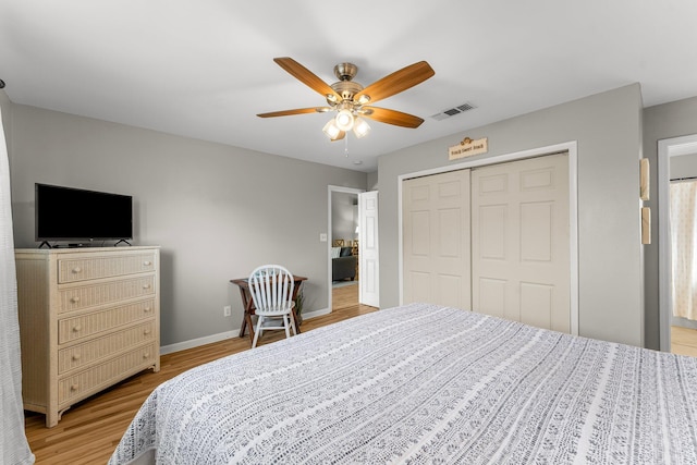3755 Scenic Highway 98 Unit 1203, Destin, FL 32541 - bedroom with light wood-type flooring, a closet, baseboards, and a ceiling fan