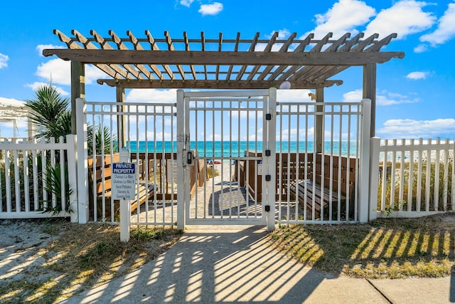 3755 Scenic Highway 98 Unit 1203, Destin, FL 32541 - gate featuring a pergola and a water view