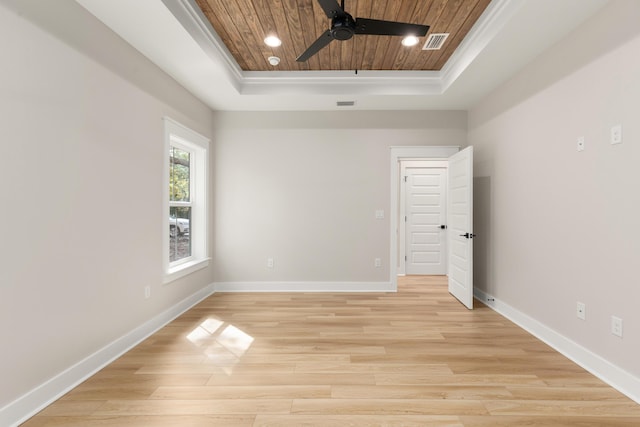 335 J Hunters Way S, Freeport, FL 32439 - empty room featuring a raised ceiling, wooden ceiling, a ceiling fan, light wood-style floors, and baseboards
