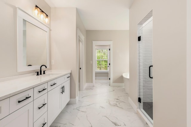 335 J Hunters Way S, Freeport, FL 32439 - full bath with marble finish flooring, vanity, baseboards, a freestanding tub, and a stall shower