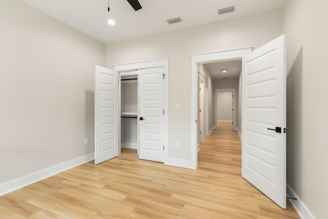 335 J Hunters Way S, Freeport, FL 32439 - unfurnished bedroom with light wood finished floors, baseboards, a closet, recessed lighting, and ceiling fan