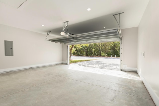 335 J Hunters Way S, Freeport, FL 32439 - garage with electric panel, baseboards, a garage door opener, and recessed lighting