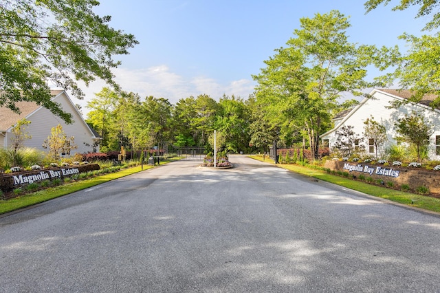 335 J Hunters Way S, Freeport, FL 32439 - view of asphalt street with a gated entry and curbs