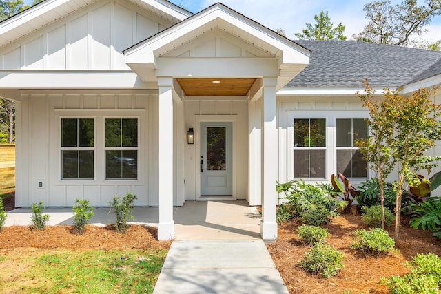 335 J Hunters Way S, Freeport, FL 32439 - entrance to property with board and batten siding, a shingled roof, and covered porch