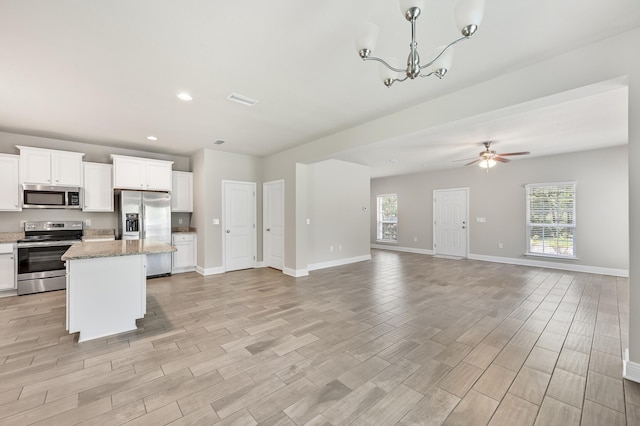 74 Tranquility Ln, Santa Rosa Beach, FL 32459 - kitchen with stainless steel appliances, open floor plan, plenty of natural light, a center island, and recessed lighting