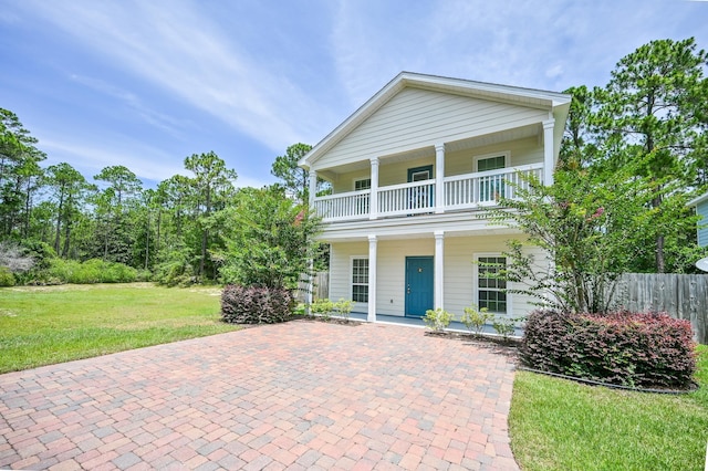 74 Tranquility Ln, Santa Rosa Beach, FL 32459 - view of front of home with a balcony and a porch