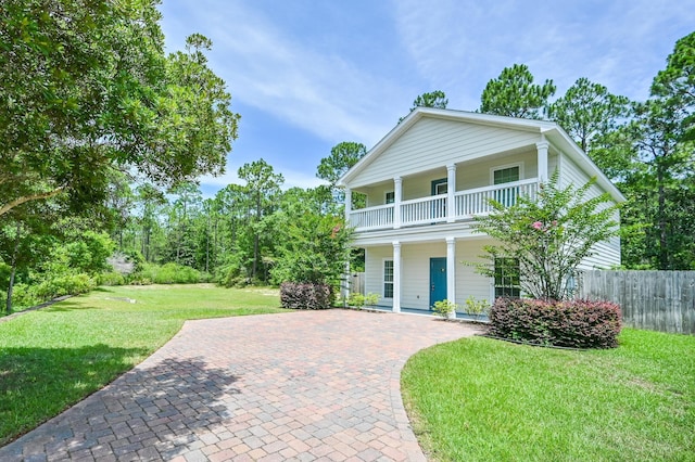 74 Tranquility Ln, Santa Rosa Beach, FL 32459 - view of front of property with a balcony and covered porch