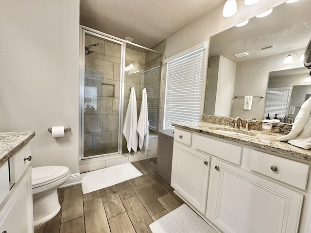 74 Tranquility Ln, Santa Rosa Beach, FL 32459 - bathroom with vanity, wood finished floors, and a shower stall