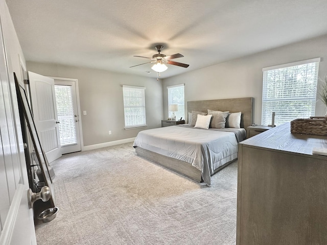 74 Tranquility Ln, Santa Rosa Beach, FL 32459 - bedroom with light colored carpet, ceiling fan, and access to exterior