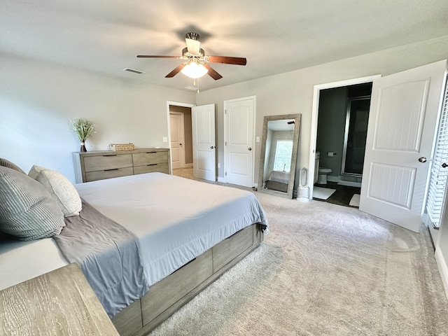 74 Tranquility Ln, Santa Rosa Beach, FL 32459 - bedroom featuring light colored carpet, connected bathroom, and a ceiling fan