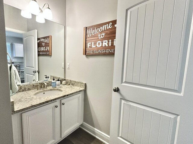 74 Tranquility Ln, Santa Rosa Beach, FL 32459 - ensuite bathroom featuring vanity and baseboards