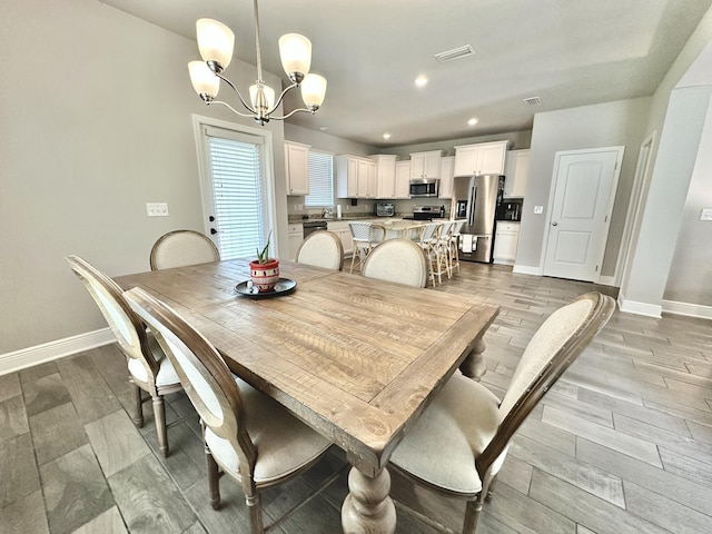 74 Tranquility Ln, Santa Rosa Beach, FL 32459 - dining area with a chandelier, light wood-type flooring, and recessed lighting
