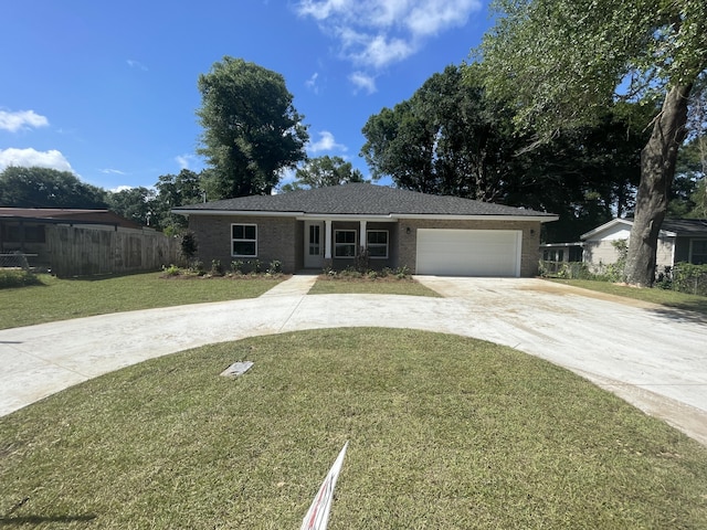 424 Ed St, Fort Walton Beach, FL 32547 - ranch-style home with driveway, brick siding, and a garage