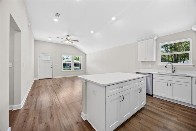 3158 Chestnut St, Crestview, FL 32539 - kitchen with a sink, a ceiling fan, dishwasher, vaulted ceiling, and wood finished floors