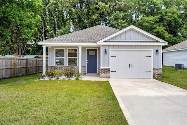 3158 Chestnut St, Crestview, FL 32539 - view of front of house featuring brick siding, a shingled roof, central AC, driveway, and a garage