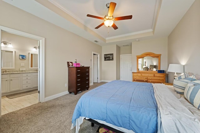 809 Whispering Creek Ave, Freeport, FL 32439 - bedroom featuring a raised ceiling, light colored carpet, ornamental molding, a sink, and baseboards