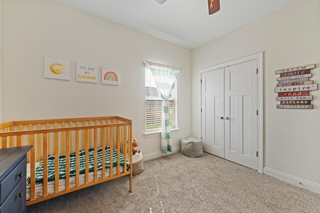 809 Whispering Creek Ave, Freeport, FL 32439 - carpeted bedroom featuring a nursery area, baseboards, a closet, and ceiling fan