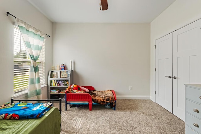 809 Whispering Creek Ave, Freeport, FL 32439 - carpeted bedroom featuring multiple windows, a closet, baseboards, and ceiling fan