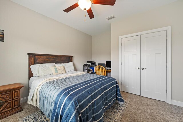 809 Whispering Creek Ave, Freeport, FL 32439 - carpeted bedroom with a ceiling fan, a closet, and baseboards