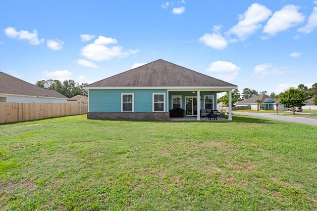 809 Whispering Creek Ave, Freeport, FL 32439 - rear view of property featuring a patio area and roof with shingles
