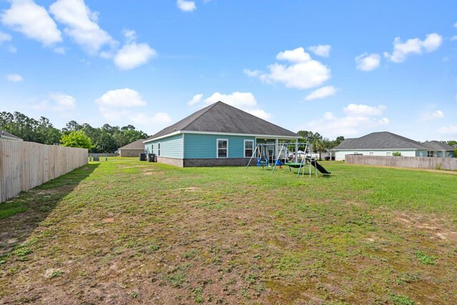 809 Whispering Creek Ave, Freeport, FL 32439 - back of property with a playground