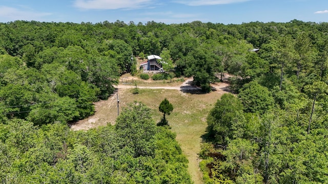 841 N 1st St, Defuniak Springs, FL 32433 - aerial view of property and surrounding area featuring a heavily wooded area