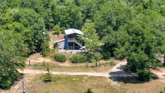 841 N 1st St, Defuniak Springs, FL 32433 - view of subject property with a heavily wooded area