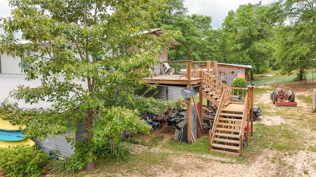 841 N 1st St, Defuniak Springs, FL 32433 - rear view of property with stairway and a deck