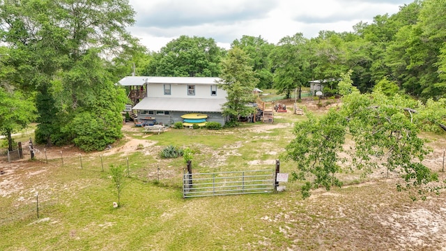 841 N 1st St, Defuniak Springs, FL 32433 - back of property featuring stairs and a wooden deck