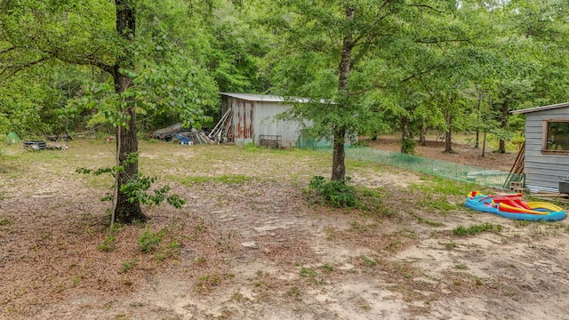 841 N 1st St, Defuniak Springs, FL 32433 - view of yard with an outbuilding and a pole building