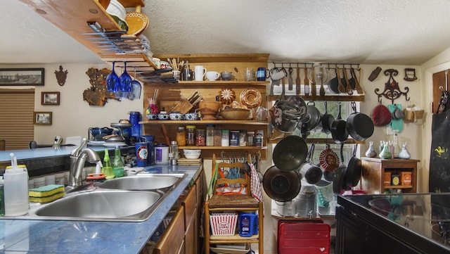 841 N 1st St, Defuniak Springs, FL 32433 - kitchen with a sink and a textured ceiling