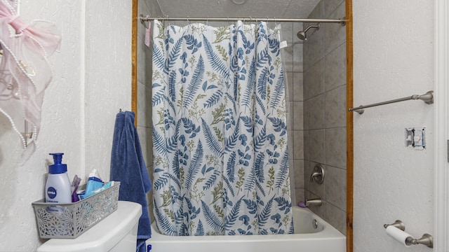 841 N 1st St, Defuniak Springs, FL 32433 - bathroom with a textured wall, shower / tub combo, and toilet